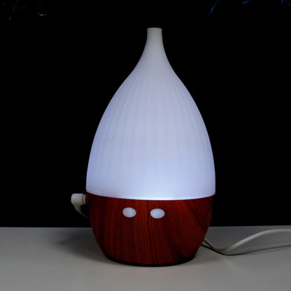 White and red diffuser on a dark background